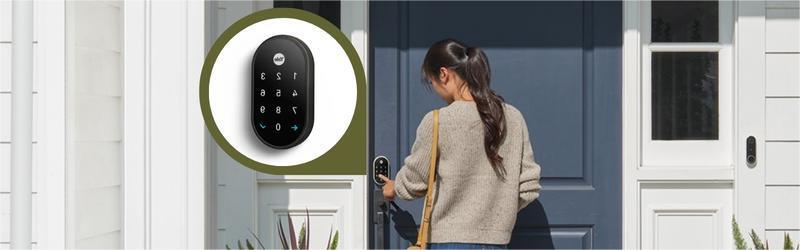A woman stands at a blue front door, entering a code on a smart door lock. An inset shows a close-up view of the lock’s keypad.