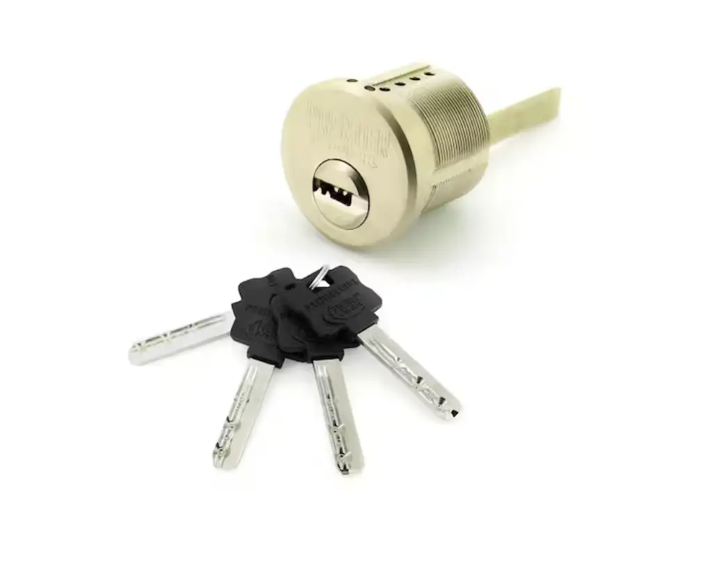 A cylinder lock with a gold finish, part of our premium Security Products, is shown alongside four silver keys with black plastic heads, all placed on a white background.
